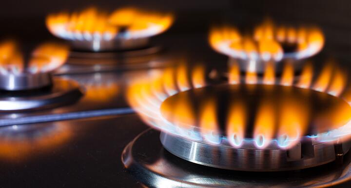 Lit gas burners on a hot stove