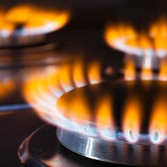 Lit gas burners on a hot stove