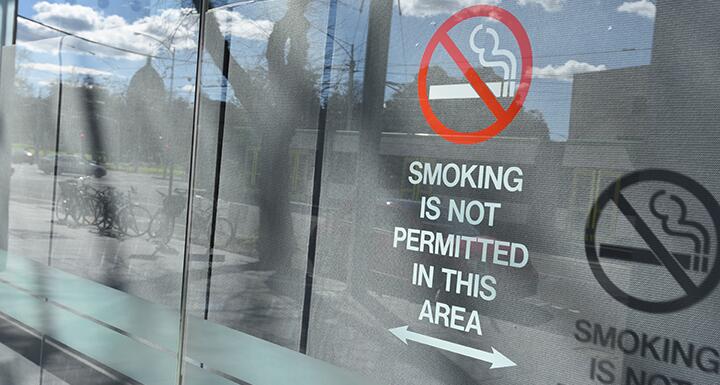 No smoking sign on glass door