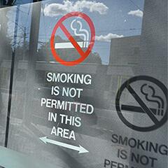 No smoking sign on glass door