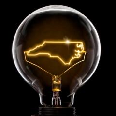 Lightbulb with filaments in the shape of the state of North Carolina