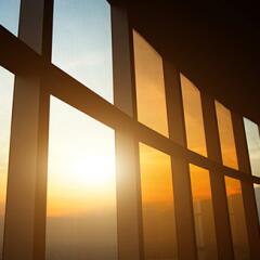 Curving windows in an office building with sunlight coming through