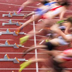 runners taking off at starting line