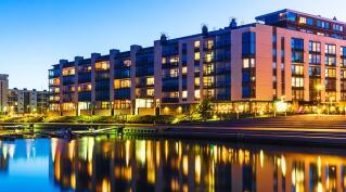 Modern apartment building overlooking a lake
