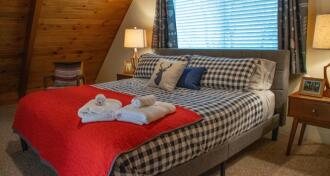 made up bed at bed and breakfast