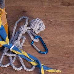 boy scout scarf, hiking boots, and other equipment on a tablre