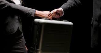 briefcase transfer between businesspeople and agents