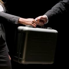 briefcase transfer between businesspeople and agents