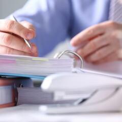 Close-up of male hands signing important business document