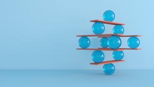 Abstract image of balls balancing on wooden slats in increasing complexity