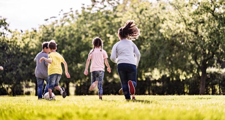 Kids Playing Soccer in a field