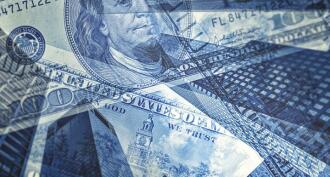 hundred dollar bills on top of downtown buildings