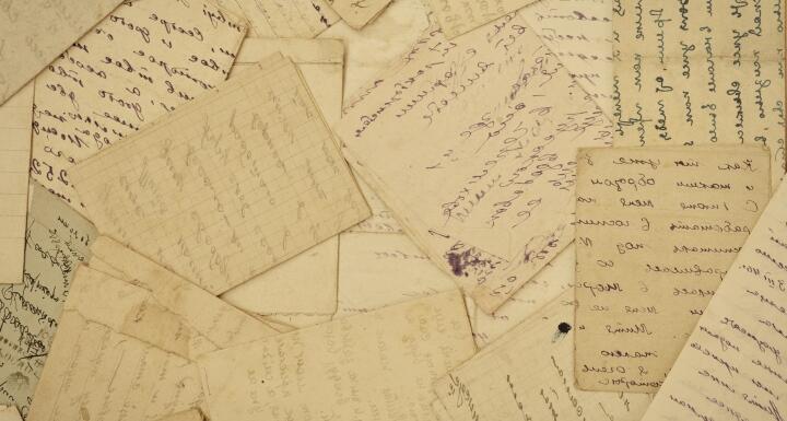 a collection of old letters on yellowed paper