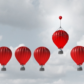 Red hot air balloons in a row