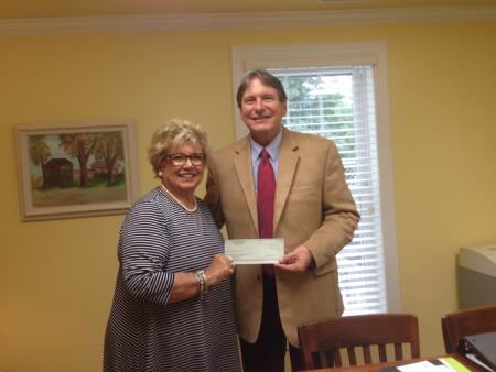 Pictured is Dianne Andrews from Interfaith Volunteers accepting a North Carolina Community Foundation Disaster Relief Fund grant award from Michael Rhodes, Greene County Community Foundation board president.