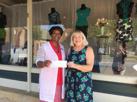 Pictured awarding a grant to Harbor, Inc. Executive Director Katrusia Johnson is Margaret Dinubila, board president.