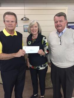 Robeson County Community Foundation Board Vice President Kenny Biggs (left) and Board Member Ken Windley (right) present a disaster relief grant award to Communities in Schools of Robeson County Executive Director Denice Lambdin.