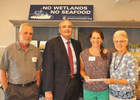 Pictured are (left to right) Todd Miller, executive director of the North Carolina Coastal Federation; Warren Judge, Dare County Commissioner; Peggy Birkemeier, Northeast NC Coastal Research and Environmental Education Fund fundholder; and Ann Daisey, community conservationist for Dare Soil and Water Conservation District and the North Carolina Coastal Federation.