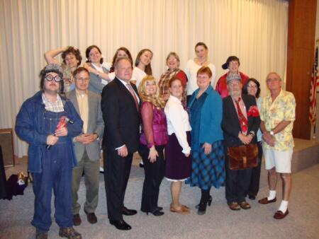 Richards is seen second from left in this photo of the mystery dinner theater.