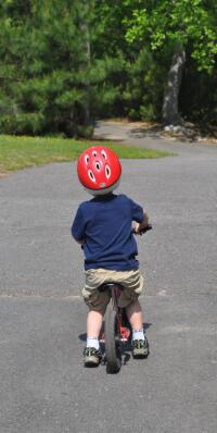 Child riding bike in park