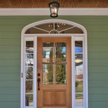 Southern Village - leaf green house with black & white trim