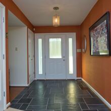 Duke Forest - russet orange sisal foyer with black slate
