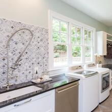 Governors Club - pale blue, black & white laundry room with art glass