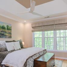 Country Club Heights - maple & beige primary bedroom with tray ceiling