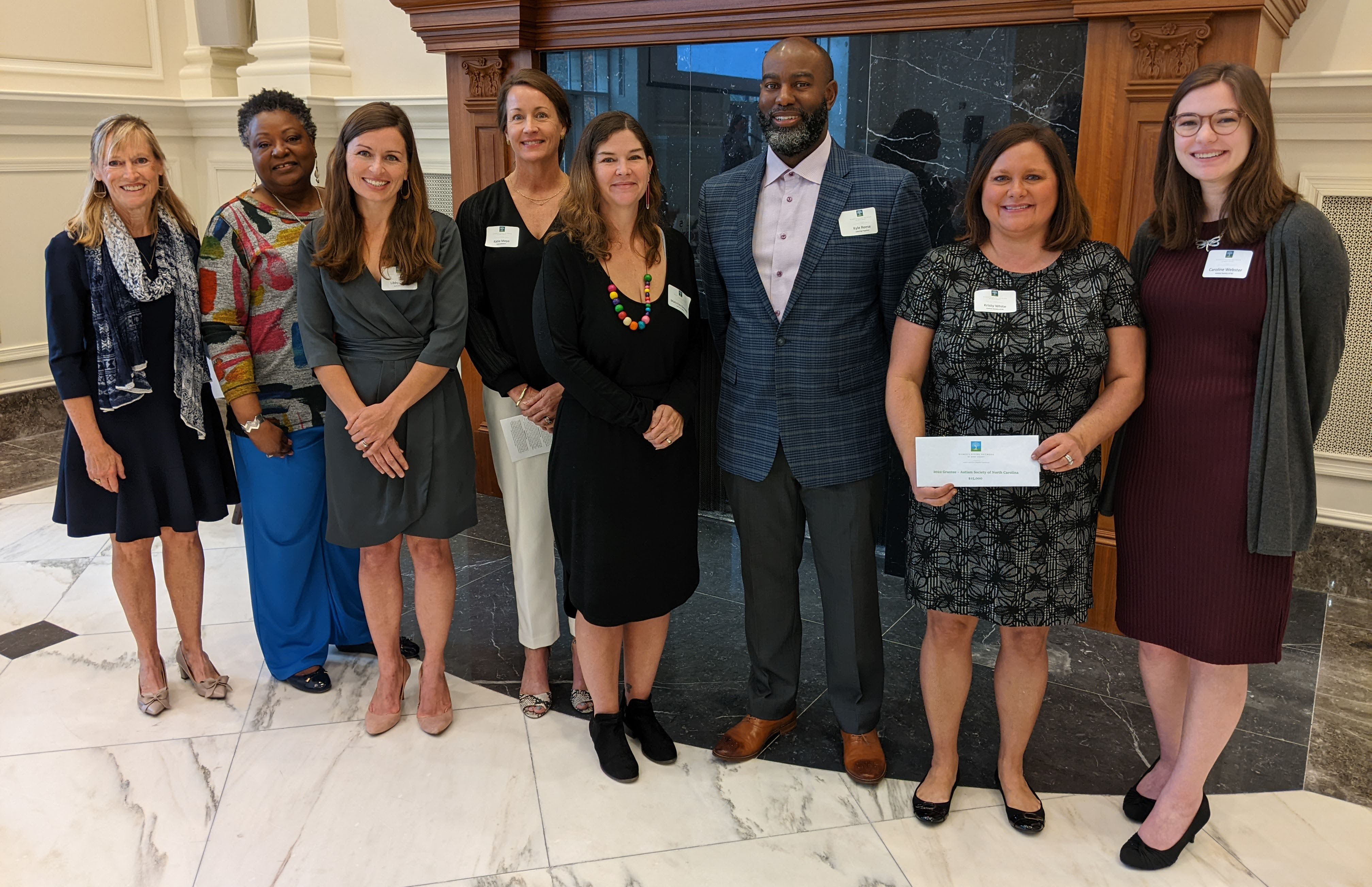 From left to right are representatives from the organizations WGN provided grants to: Kim Shirley and Debra Smallwood of Seasons Village; Libby Coles and Katie Moye of JusticeMatters; Mary Kay Kennedy and Kyle Reese of Learning Together; and Kristy White and Caroline Webster of the Autism Society of North Carolina.