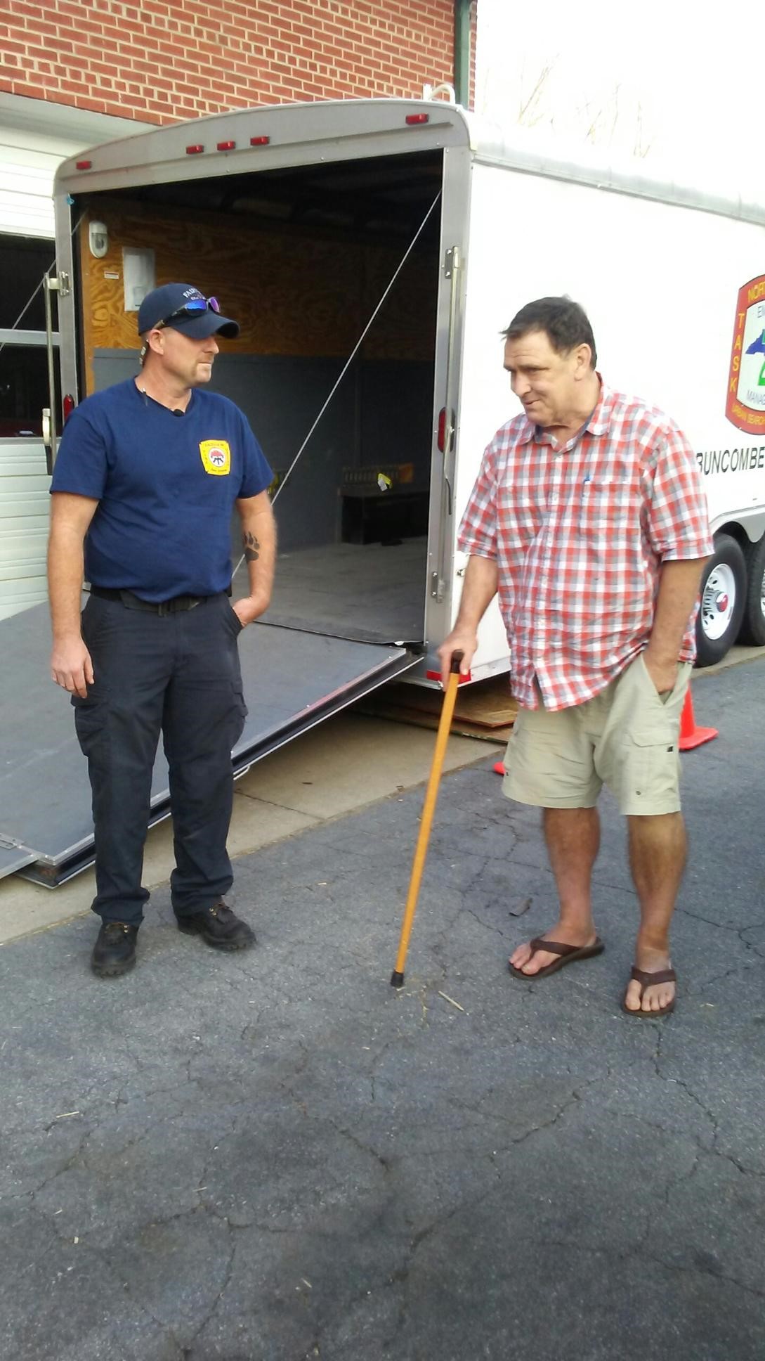 Barry Doyle (right) delivers provisions in western North Carolina.