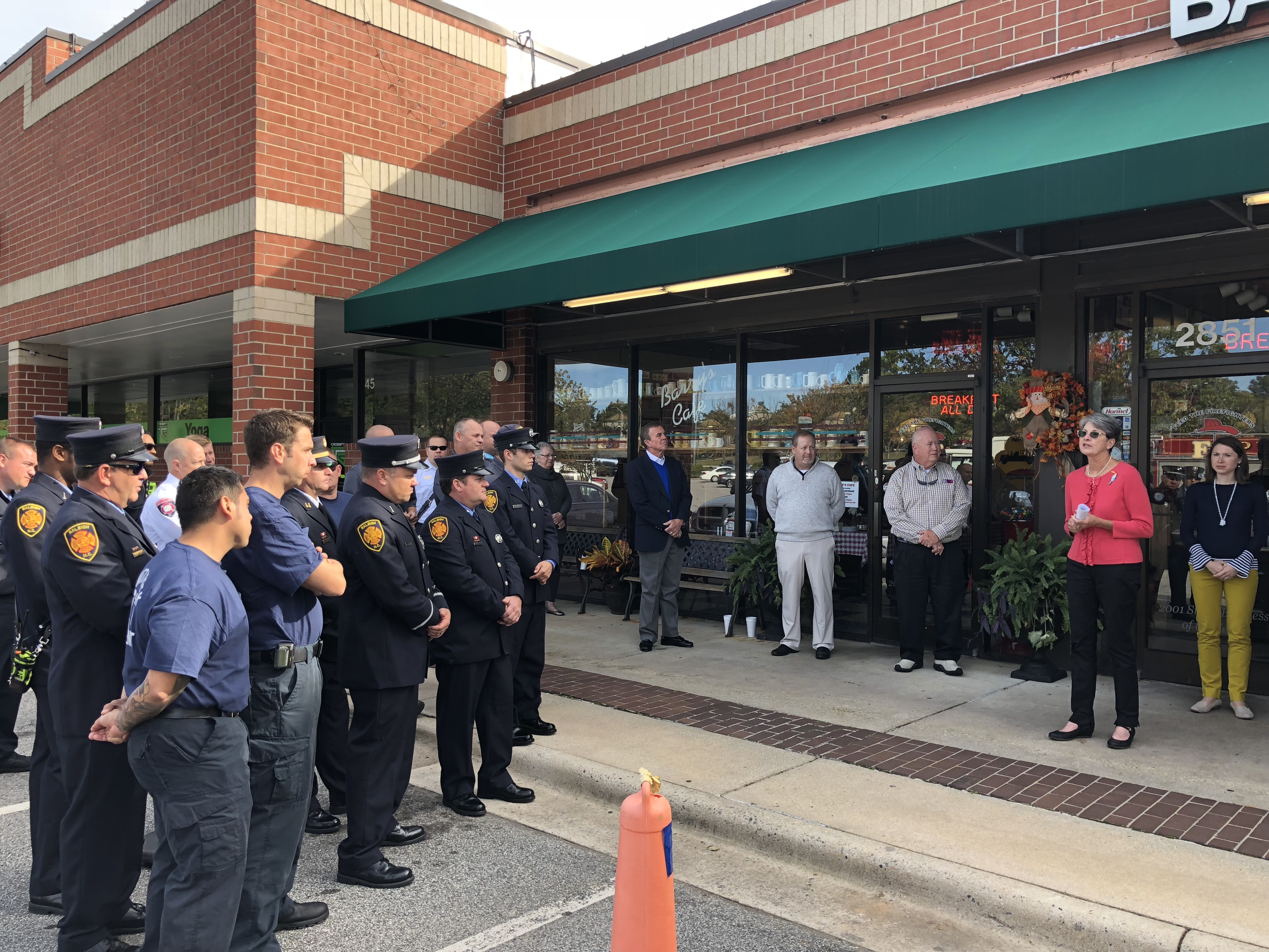 Denise Doyle, center, thanks everyone for attending the ceremony to kick off the Barry J. Doyle Scholarship to benefit firefighters in Wake County.