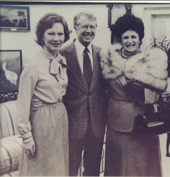 Powers (right) pictured with her cousin, former President Jimmy Carter and former the late Rosalynn Carter