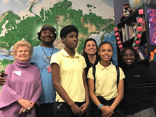 GLOW Academy students and staff pose for a photo with Judy Girard, pictured far left.