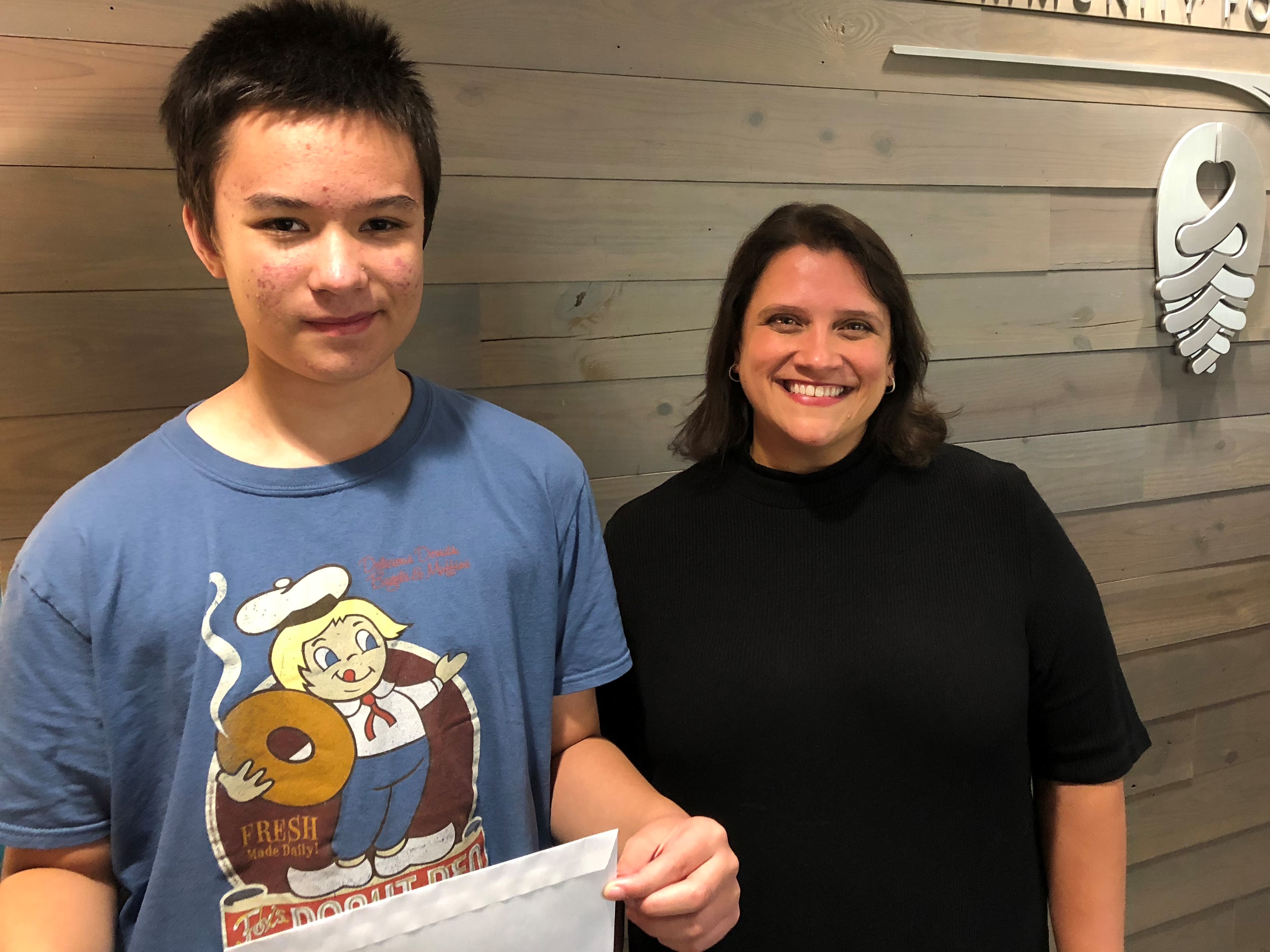 Philip Wong, who attends Exploris Middle School in Raleigh, saved up his allowance and personally delivered his donation to NCCF’s Disaster Relief Fund. Leslie Ann Jackson, director of grants and scholarships, was happy to accept this gift from the heart.