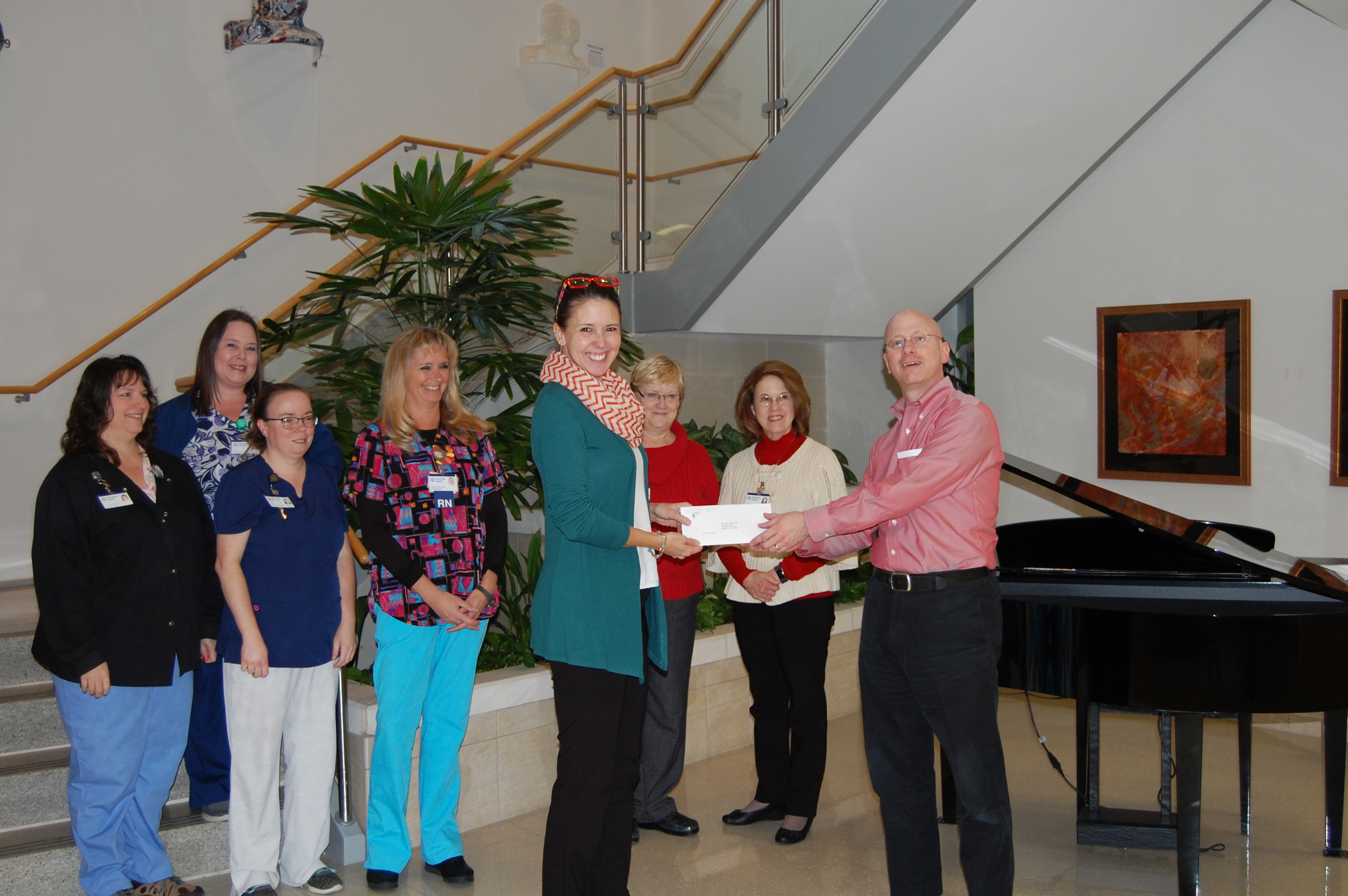 Staff members from Randolph Health are pictured accepting the grant award from NCCF Regional Director Dawn Neighbors.