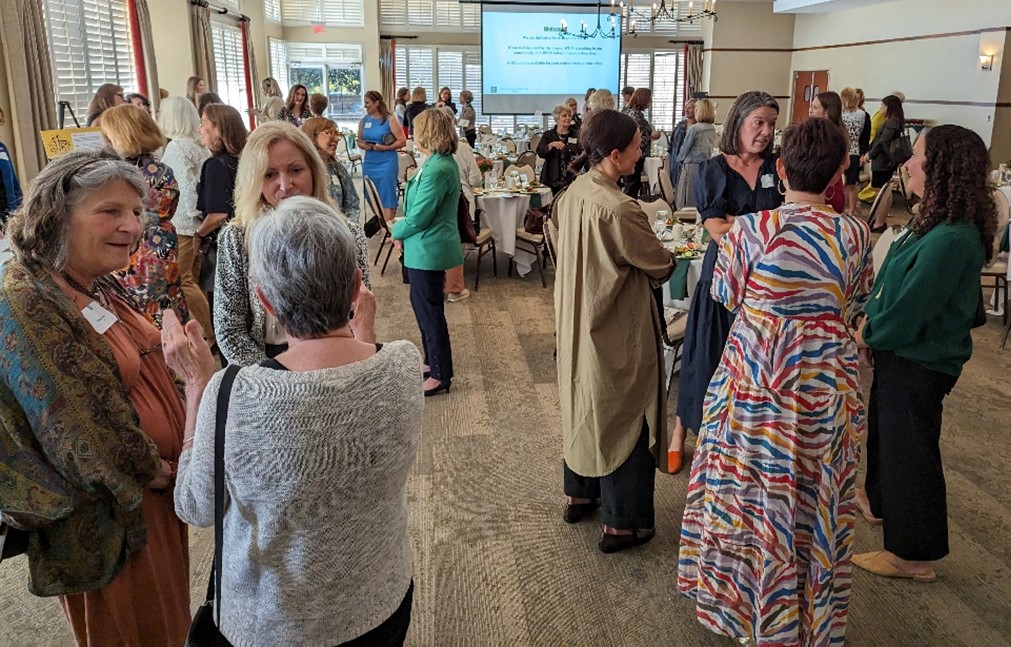 Attendees mingle at the Women's Giving Network of Wake County’s 17th Annual IMPACT Luncheon on Nov. 8 at the NC State University Club.