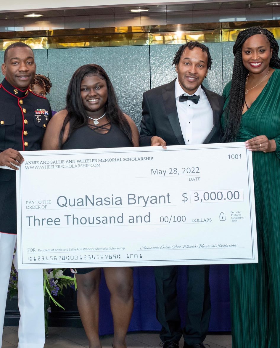QuaNasia Bryant with scholarship founders Jamaal Pittman and Linwood Hinton, and Tenikka Hughes