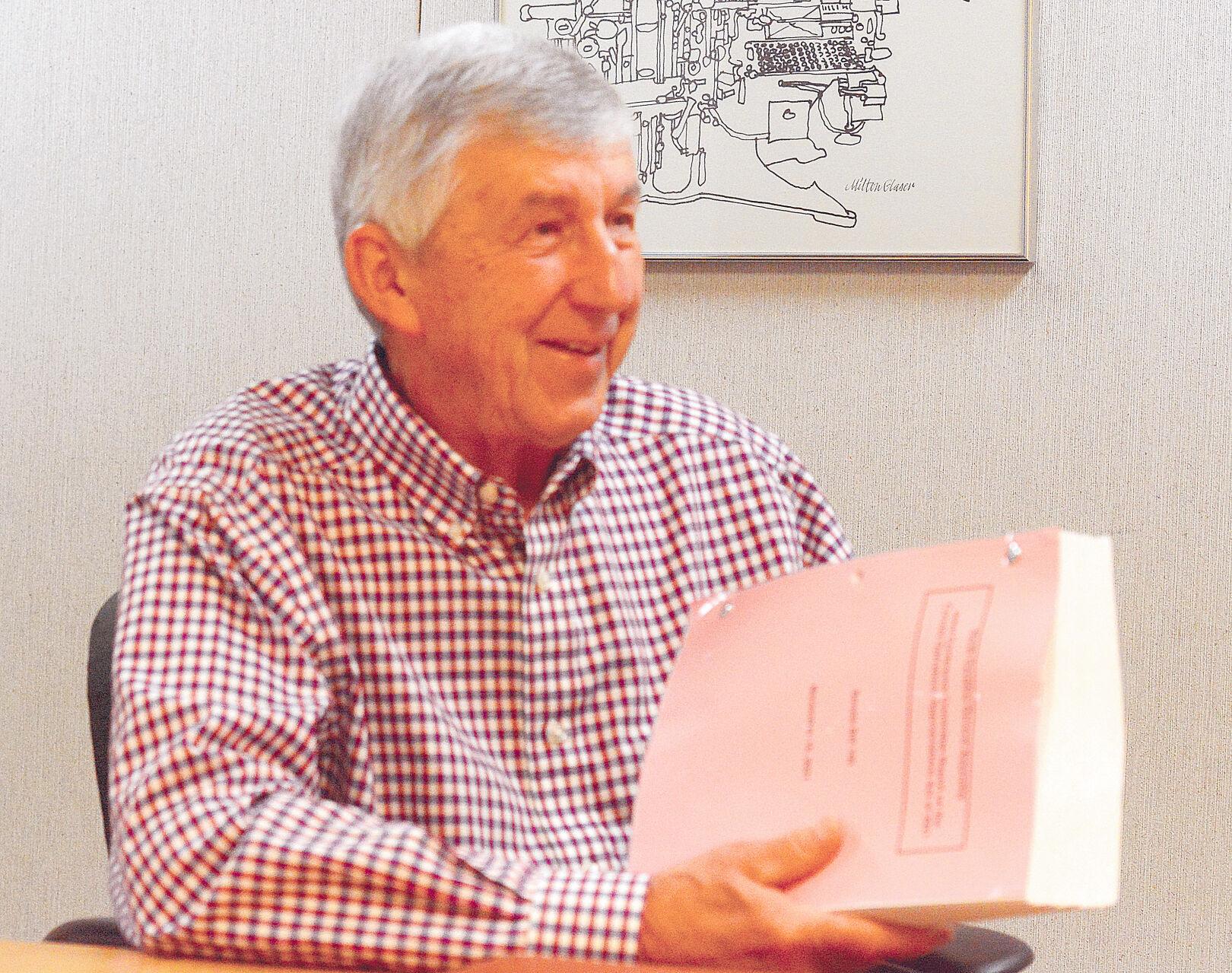 Sen. Dean Proctor, of Catawba County, holds a copy of part of the state budget, which includes funding for a regional vocational training center run through Catawba Valley Community College. Photo by Robert C. Reed, Hickory Daily Record