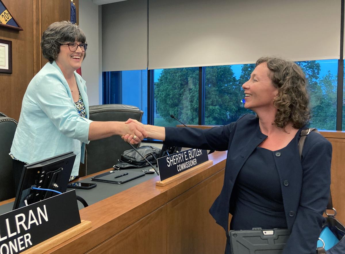 Catawba County Commissioner Sherry Butler, left, congratulates Mary Furtado on being named the next county manager.  Photo by Virginia Annable, Hickory Daily Record