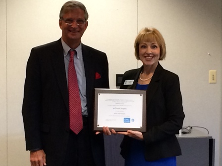 Catawba County Commission Chair Randy Isenhower is presented the fiber ready certification for the ncDataCampus by Kathleen Evans of AT&T.