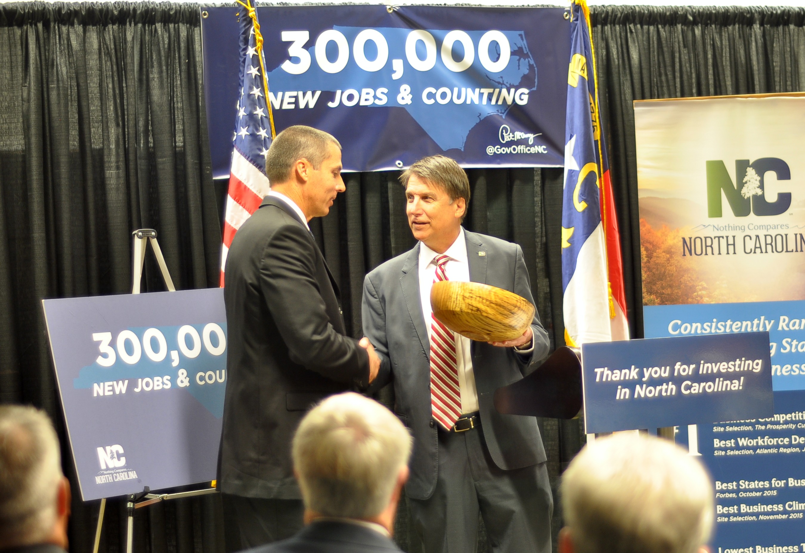 Gov. Pat McCrory presents Corning Optical Communications' Don Hefner (Regional Engineering Manager) with a handcrafted award commemorating the expansion announcement.